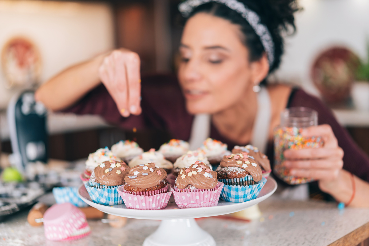 Confectioner decorating Chocolate Muffins